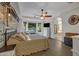 Spacious main bedroom with a rustic feel, ensuite bath access, and ample closet space at 21151 E Mewes Rd, Queen Creek, AZ 85142