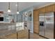 Modern kitchen with granite counters, stainless steel appliances, and an island at 21151 E Mewes Rd, Queen Creek, AZ 85142