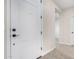 Front entry with white door and grey tile floor at 9239 E Spiral Ave, Mesa, AZ 85212