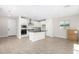 Modern kitchen with white cabinets, dark countertop island, and stainless steel appliances at 9239 E Spiral Ave, Mesa, AZ 85212