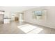 Open concept kitchen with island, stainless steel appliances, and tile flooring at 9239 E Spiral Ave, Mesa, AZ 85212