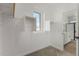 Bright walk-in closet with built-in shelves and rods at 9239 E Spiral Ave, Mesa, AZ 85212