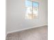 Bright bedroom with grey tile floors and a view at 9239 E Spiral Ave, Mesa, AZ 85212