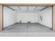 Open two-car garage with concrete floor at 9239 E Spiral Ave, Mesa, AZ 85212