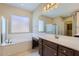 Bathroom features soaking tub, double vanity, and walk-in shower at 26562 W Vista North Dr, Buckeye, AZ 85396