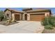 Two-story home with stone elevation and desert landscaping at 26562 W Vista North Dr, Buckeye, AZ 85396