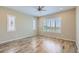 Spacious bedroom with hardwood floors and plantation shutters at 26562 W Vista North Dr, Buckeye, AZ 85396
