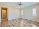 Bright bedroom with hardwood floors and ceiling fan at 26562 W Vista North Dr, Buckeye, AZ 85396