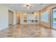 Bright living room with hardwood floors and built-in shelving at 26562 W Vista North Dr, Buckeye, AZ 85396