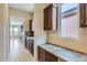 Home office with granite countertop and built-in cabinetry at 26562 W Vista North Dr, Buckeye, AZ 85396