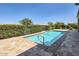 Relaxing private pool with stone patio and ample sunbathing space at 26562 W Vista North Dr, Buckeye, AZ 85396