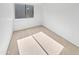 Well-lit bedroom with neutral carpeting and large window at 2040 S Longmore -- # 80, Mesa, AZ 85202