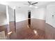 Spacious living area with dark hardwood floors and a view of the kitchen at 2040 S Longmore -- # 80, Mesa, AZ 85202