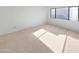 Simple bedroom with neutral carpet and large window at 2040 S Longmore -- # 80, Mesa, AZ 85202