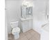 Clean bathroom with white vanity, toilet, and built-in storage at 2040 S Longmore -- # 80, Mesa, AZ 85202
