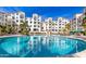 Community pool with surrounding lounge chairs at 2511 W Queen Creek Rd # 425, Chandler, AZ 85248