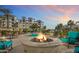 Community pool area with fire pit and lounge chairs at 2511 W Queen Creek Rd # 425, Chandler, AZ 85248