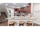 Eat-in kitchen boasts granite island with seating and stainless steel appliances at 2511 W Queen Creek Rd # 425, Chandler, AZ 85248
