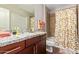 Bathroom with granite countertop and updated shower/tub at 2511 W Queen Creek Rd # 425, Chandler, AZ 85248