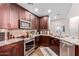 Well-equipped kitchen with ample cabinetry, granite counters, and stainless steel appliances at 2511 W Queen Creek Rd # 425, Chandler, AZ 85248