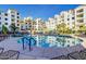 Relaxing community pool with surrounding lounge chairs at 2511 W Queen Creek Rd # 425, Chandler, AZ 85248