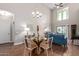 Dining area with a round glass table and white chairs at 2511 W Queen Creek Rd # 425, Chandler, AZ 85248