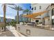 Outdoor grilling station with seating near the pool at 2511 W Queen Creek Rd # 425, Chandler, AZ 85248