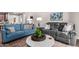Living room with comfortable gray and blue sofas at 2511 W Queen Creek Rd # 425, Chandler, AZ 85248