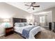 Bright bedroom with a ceiling fan and large bed at 2511 W Queen Creek Rd # 425, Chandler, AZ 85248