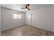Well-lit bedroom, wood-look floors, and sliding door closet at 7101 N 36Th Ave # 102, Phoenix, AZ 85051