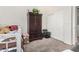 Bedroom with daybed, armoire, and double doors at 1201 W Washington Ave, Gilbert, AZ 85233