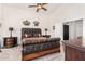 Large bedroom with king-size bed and dark wood furniture at 1201 W Washington Ave, Gilbert, AZ 85233