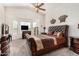 Main bedroom with a king-size bed and a ceiling fan at 1201 W Washington Ave, Gilbert, AZ 85233
