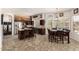 Kitchen with granite counters, dark wood cabinets, and island at 1201 W Washington Ave, Gilbert, AZ 85233