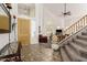 Bright and spacious entryway with tiled floors and staircase at 1201 W Washington Ave, Gilbert, AZ 85233