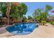 Inviting kidney-shaped pool surrounded by a flagstone patio at 1201 W Washington Ave, Gilbert, AZ 85233