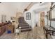 Elegant entryway with staircase, tiled floors, and natural light at 1201 W Washington Ave, Gilbert, AZ 85233