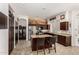 Well-equipped kitchen with stainless steel appliances and breakfast bar at 1201 W Washington Ave, Gilbert, AZ 85233