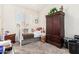 Cozy bedroom with a daybed and a wooden armoire at 1201 W Washington Ave, Gilbert, AZ 85233