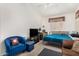 Versatile room with sofa, bed, and window seat at 1201 W Washington Ave, Gilbert, AZ 85233