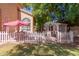 Charming backyard with a quaint shed and white picket fence at 1201 W Washington Ave, Gilbert, AZ 85233