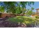 Spacious backyard with pool, palm trees, and lush landscaping at 1201 W Washington Ave, Gilbert, AZ 85233
