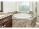 Bathroom with a large garden tub and a separate shower at 1201 W Washington Ave, Gilbert, AZ 85233