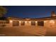 Four-car garage with lighting and brick driveway at 10947 E Wingspan Way, Scottsdale, AZ 85255