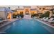 Resort-style pool with multiple lounge chairs and a cabana at 10947 E Wingspan Way, Scottsdale, AZ 85255