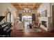 Elegant living room with hardwood floors, fireplace, and views at 10947 E Wingspan Way, Scottsdale, AZ 85255
