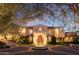 Impressive home exterior with double doors and fountain at 10947 E Wingspan Way, Scottsdale, AZ 85255