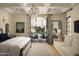 Main bedroom with access to private patio and sitting area at 10947 E Wingspan Way, Scottsdale, AZ 85255
