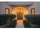 Inviting entryway with arched gate and meticulously landscaped walkway at 10947 E Wingspan Way, Scottsdale, AZ 85255