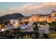 Luxury estate with a large pool, outdoor seating, and mountain views at 10947 E Wingspan Way, Scottsdale, AZ 85255